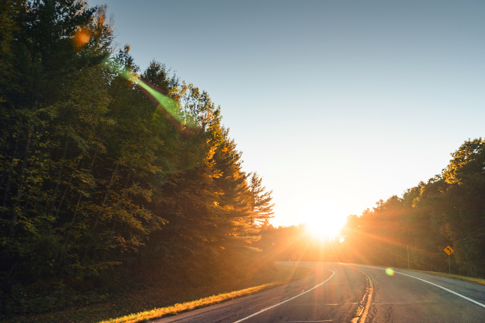 Open road ahead with bright sunshine